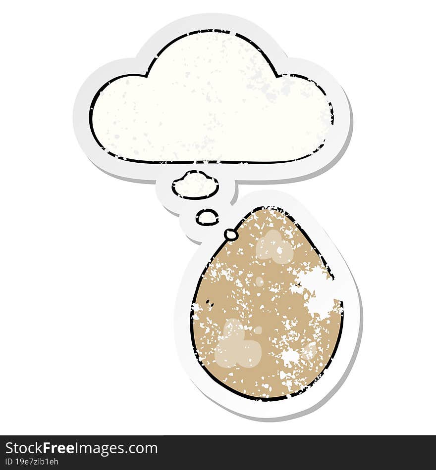 cartoon egg with thought bubble as a distressed worn sticker