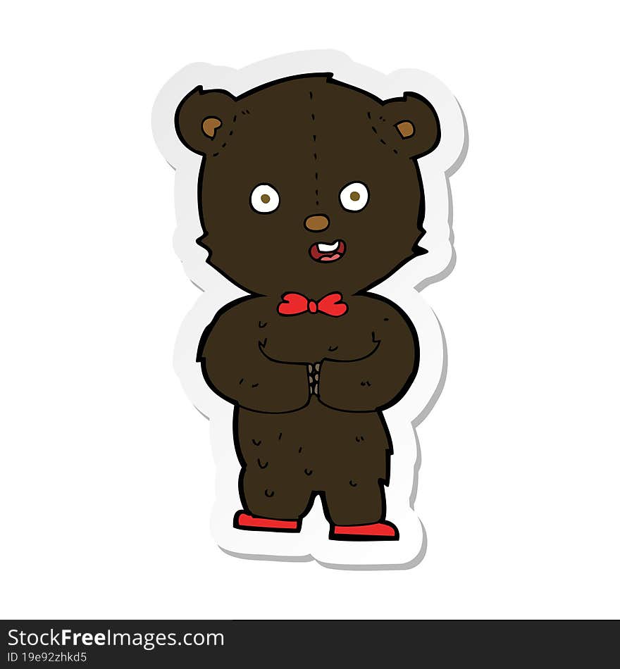 sticker of a cartoon teddy black bear