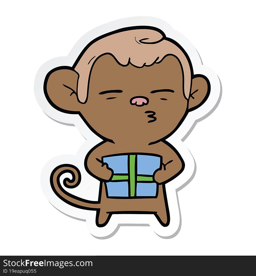 sticker of a cartoon suspicious monkey with present