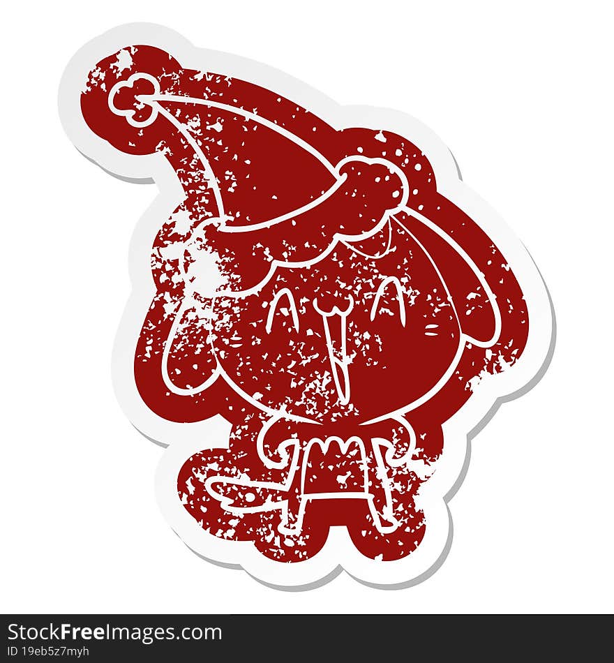 cute cartoon distressed sticker of a dog wearing santa hat