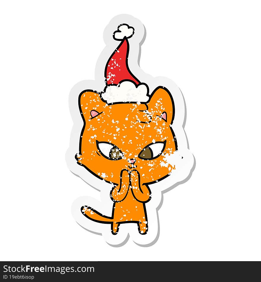 cute distressed sticker cartoon of a cat wearing santa hat