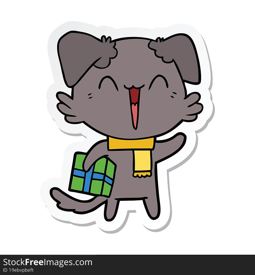 sticker of a happy little cartoon dog in winter clothes