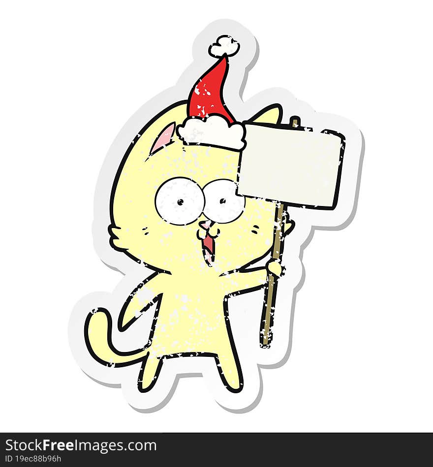 funny distressed sticker cartoon of a cat with sign wearing santa hat