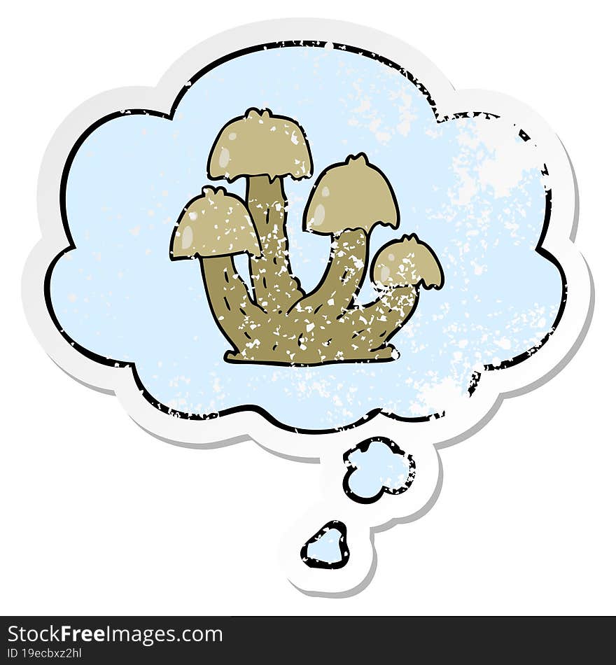 cartoon mushrooms and thought bubble as a distressed worn sticker