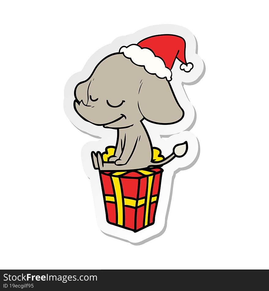 sticker cartoon of a smiling elephant wearing santa hat