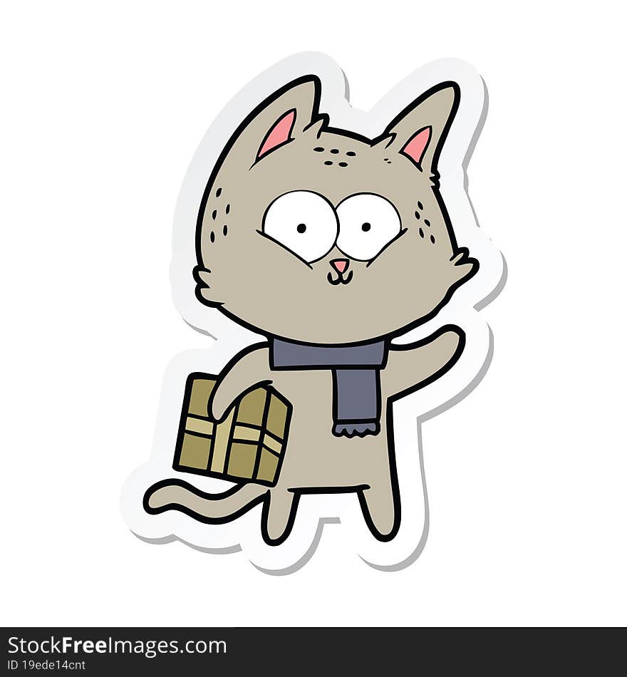 sticker of a cartoon cat holding christmas present