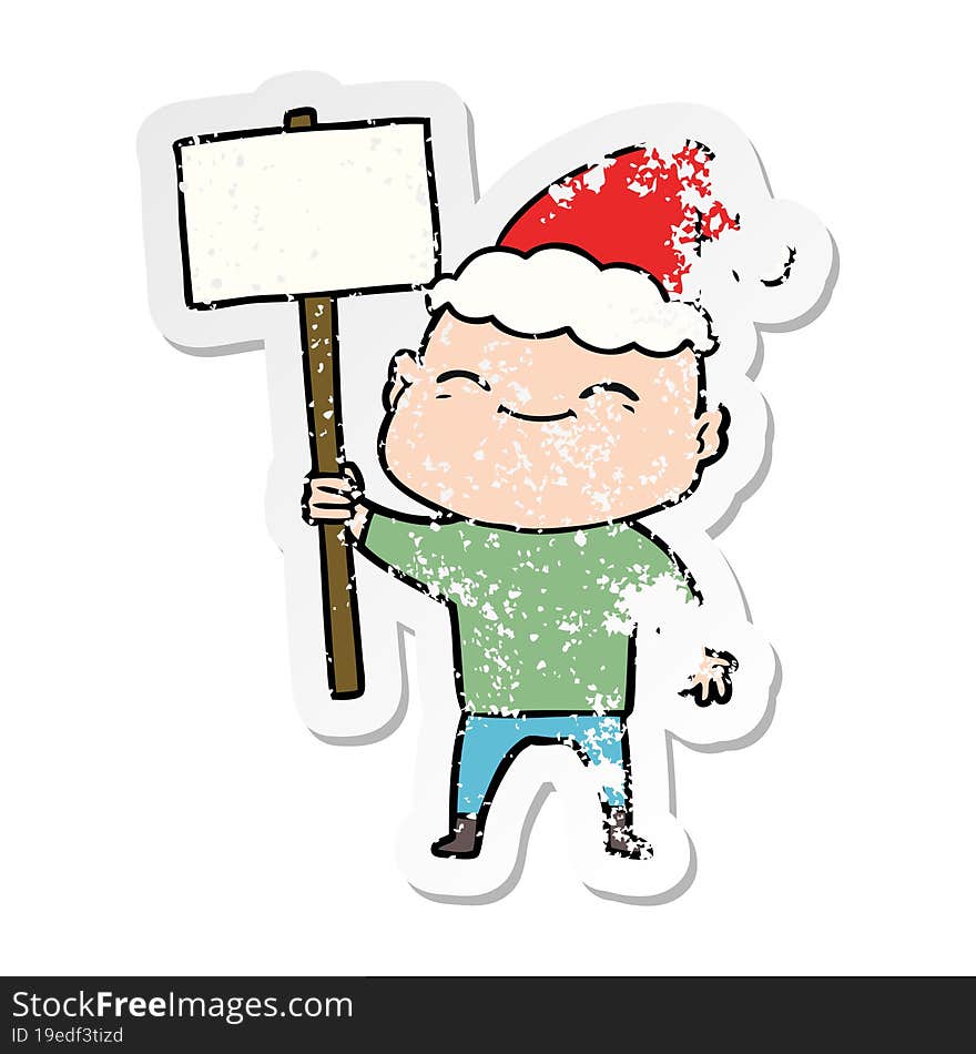 Happy Distressed Sticker Cartoon Of A Bald Man Wearing Santa Hat