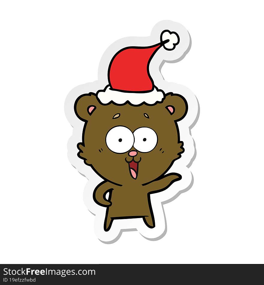 laughing teddy  bear sticker cartoon of a wearing santa hat