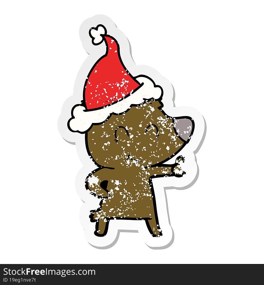 female bear distressed sticker cartoon of a wearing santa hat