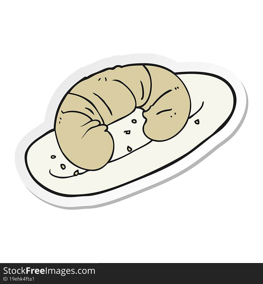 sticker of a cartoon croissant