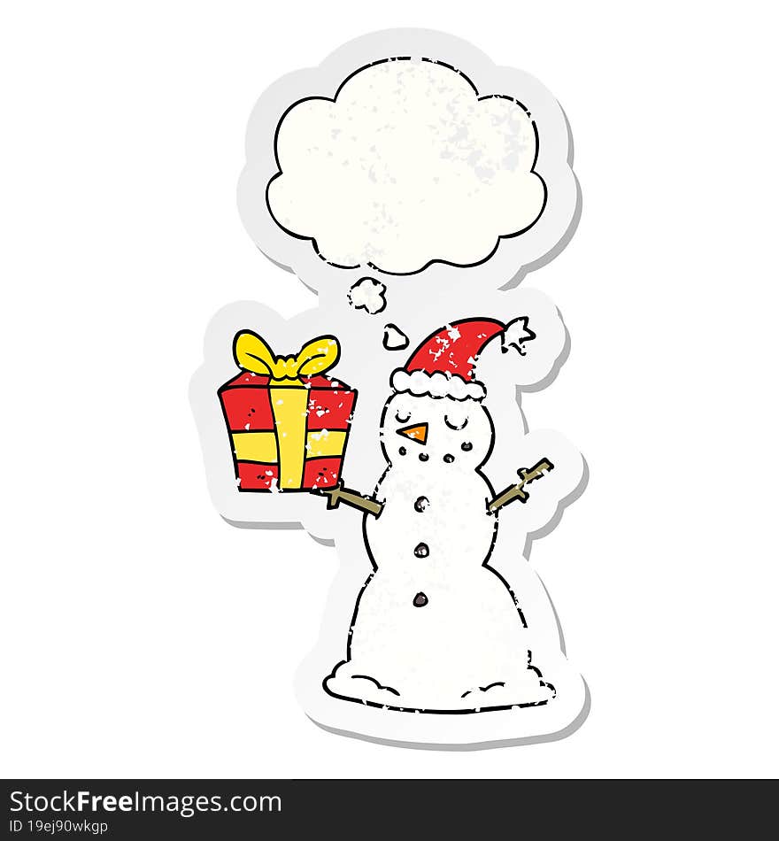 cartoon snowman with present and thought bubble as a distressed worn sticker