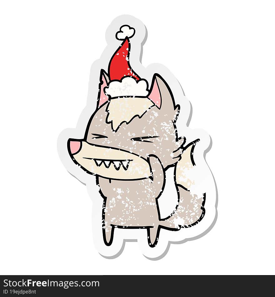 angry wolf distressed sticker cartoon of a wearing santa hat