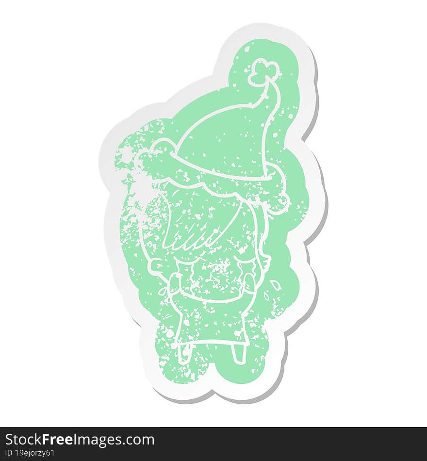 cartoon distressed sticker of a crying girl wearing santa hat