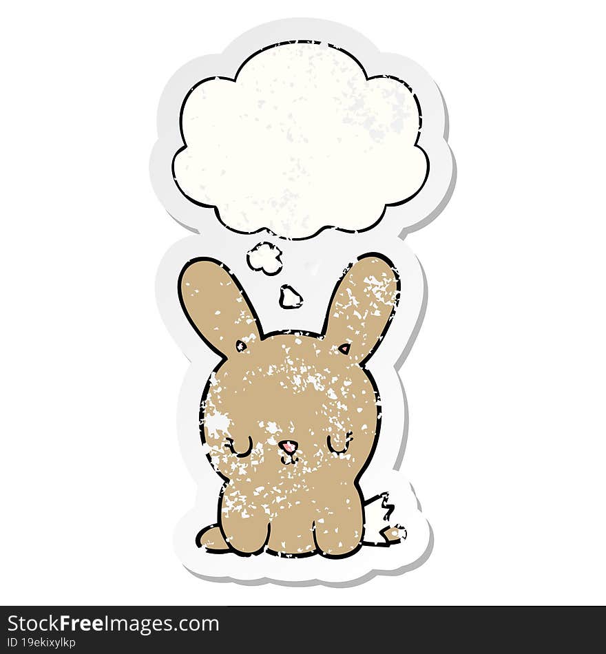 cute cartoon rabbit and thought bubble as a distressed worn sticker