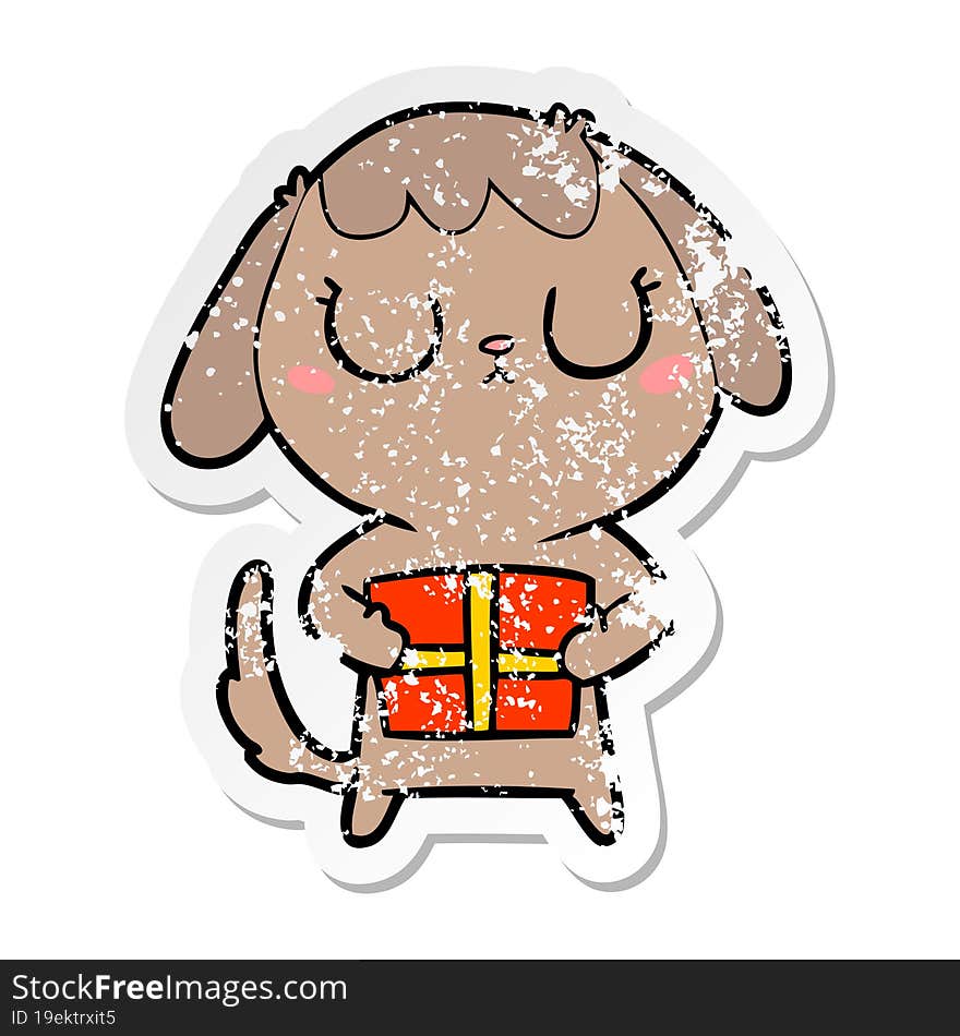 Distressed Sticker Of A Cute Cartoon Dog With Christmas Present