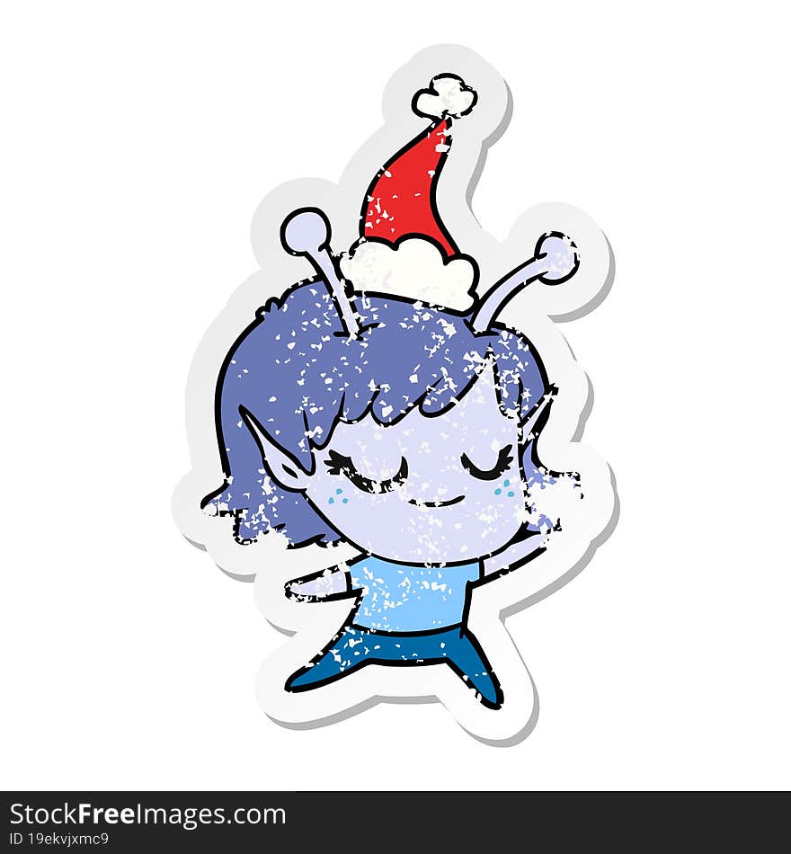 smiling alien girl distressed sticker cartoon of a wearing santa hat