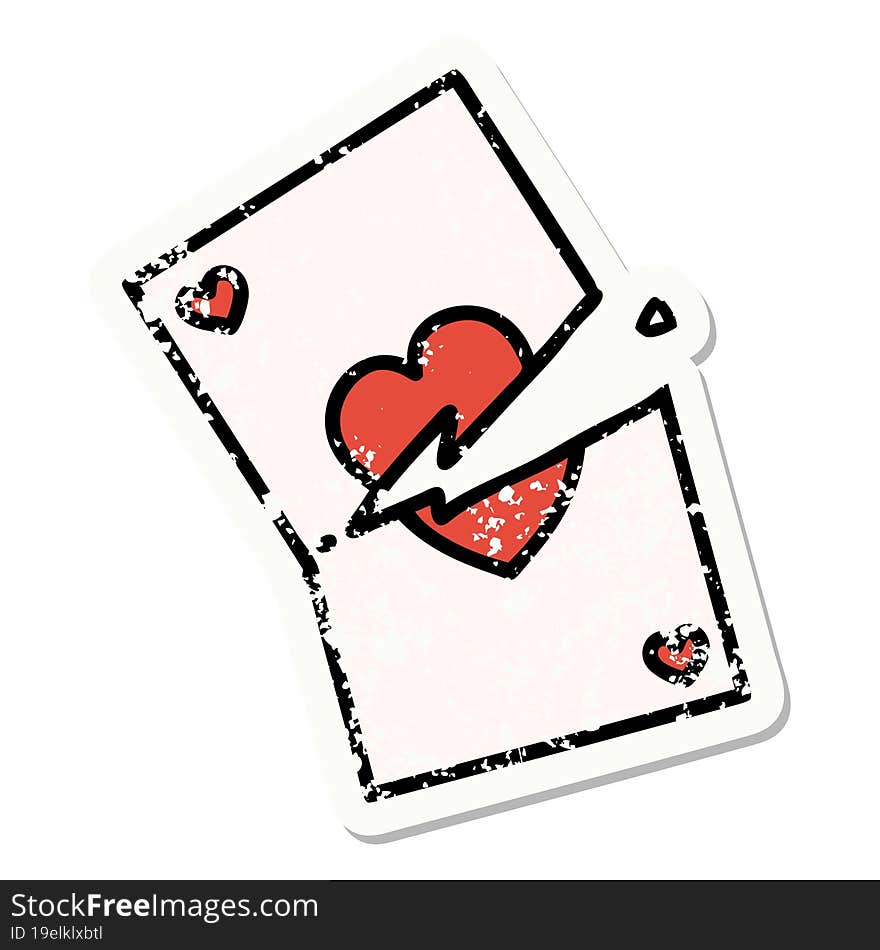 Traditional Distressed Sticker Tattoo Of A Torn Card