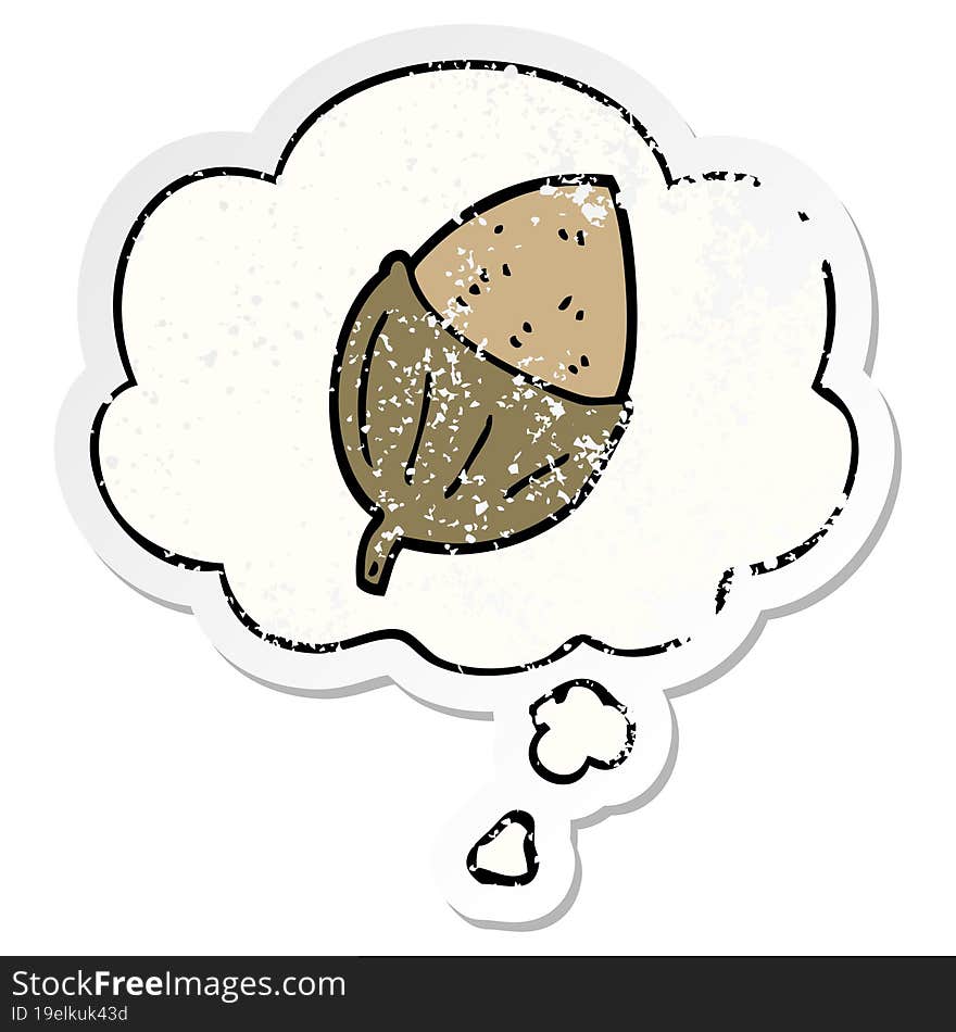 cartoon acorn and thought bubble as a distressed worn sticker