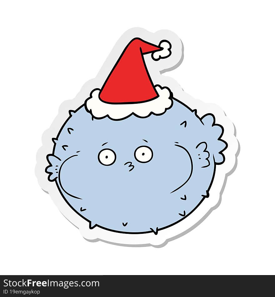 sticker cartoon of a puffer fish wearing santa hat