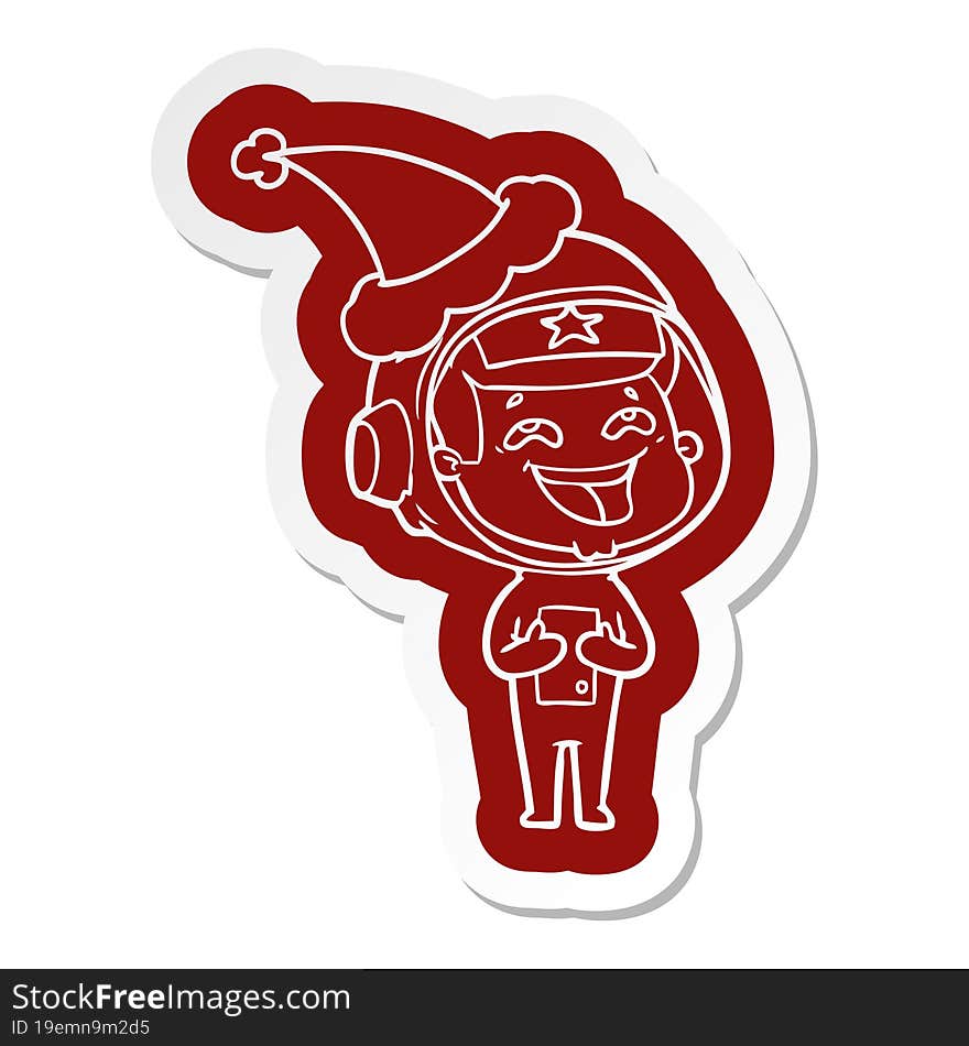 cartoon  sticker of a laughing astronaut wearing santa hat