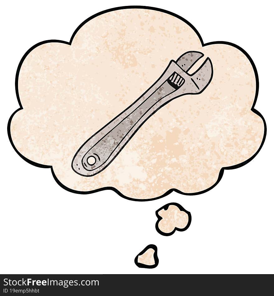 cartoon spanner and thought bubble in grunge texture pattern style