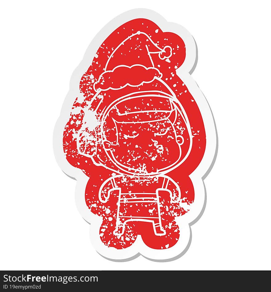 cartoon distressed sticker of a confident astronaut wearing santa hat