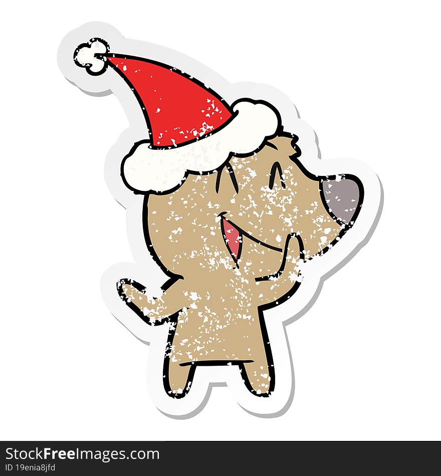 laughing bear distressed sticker cartoon of a wearing santa hat