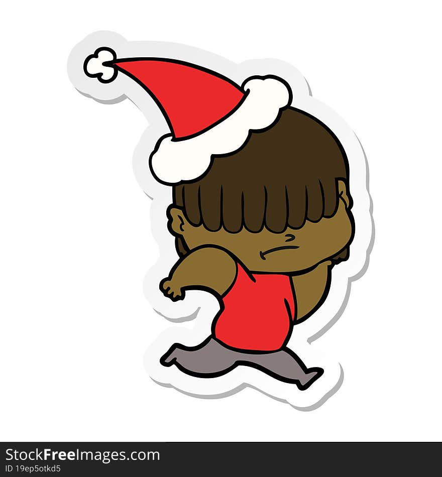 hand drawn sticker cartoon of a boy with untidy hair wearing santa hat