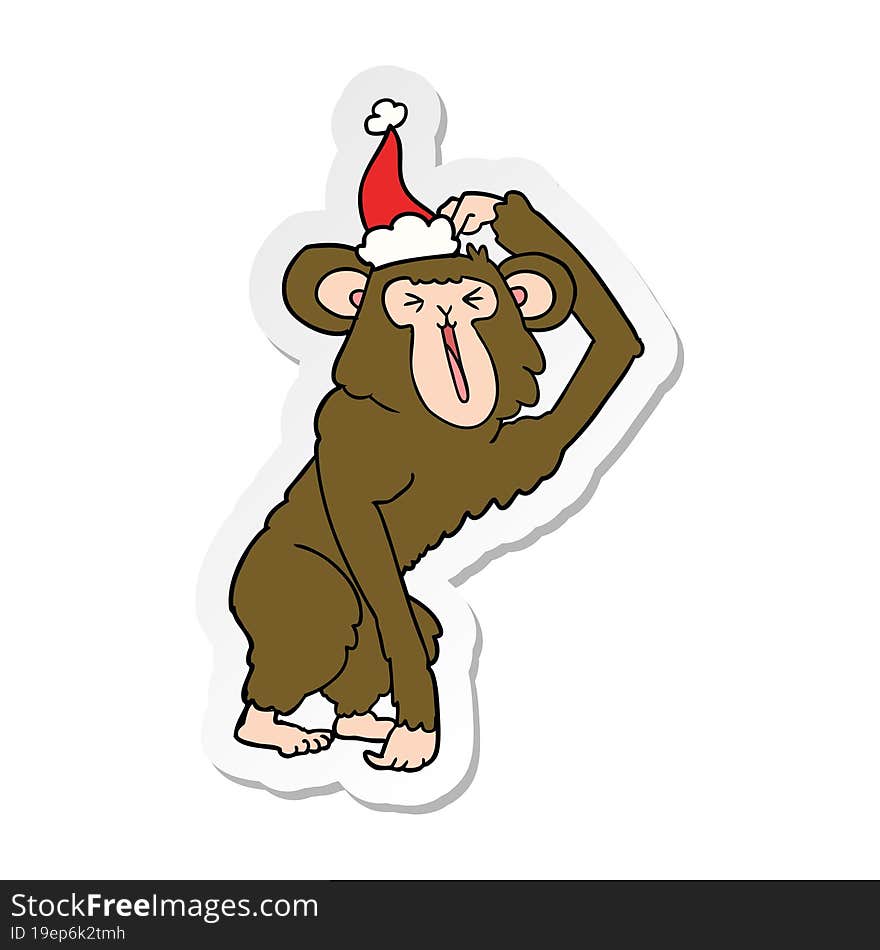 hand drawn sticker cartoon of a chimp scratching head wearing santa hat