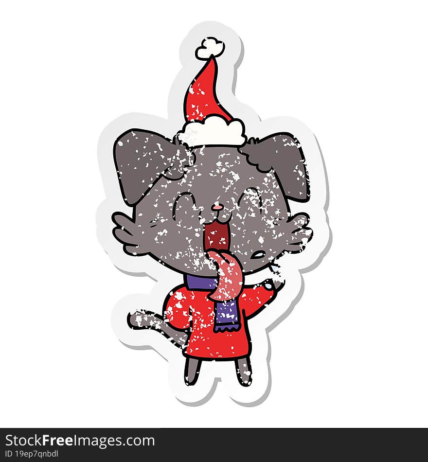 distressed sticker cartoon of a panting dog wearing santa hat