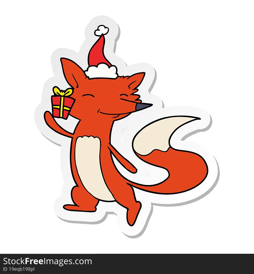 sticker cartoon of a happy fox wearing santa hat