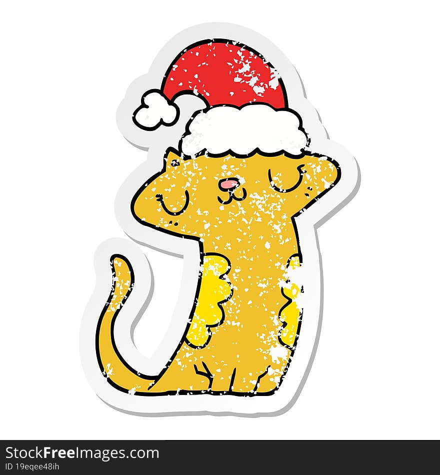 distressed sticker of a cute cartoon cat wearing christmas hat