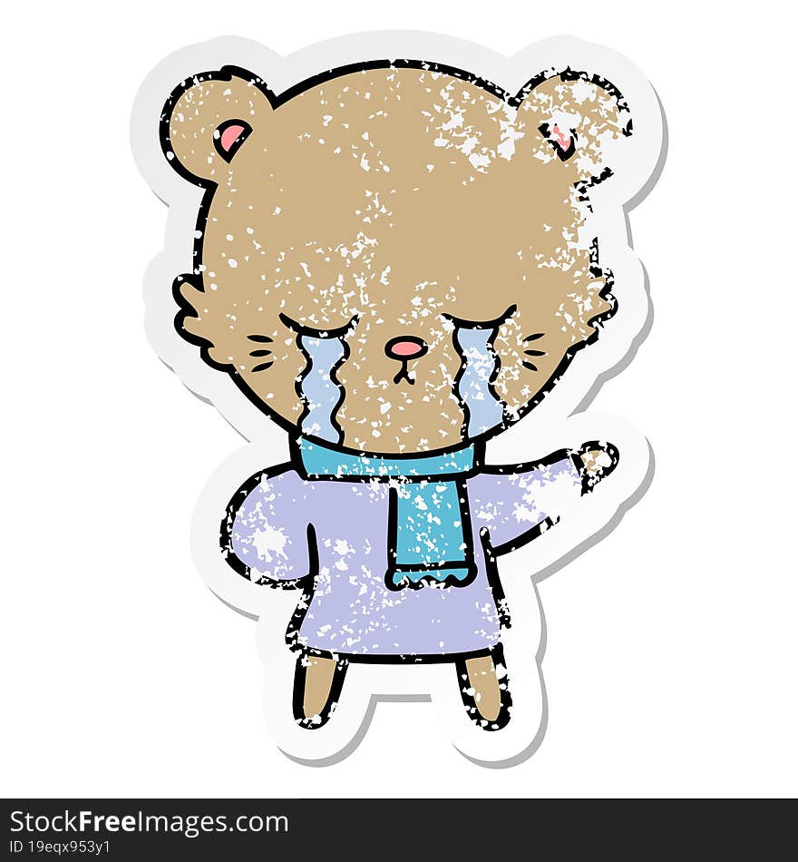 distressed sticker of a crying cartoon bear wearing winter clothes