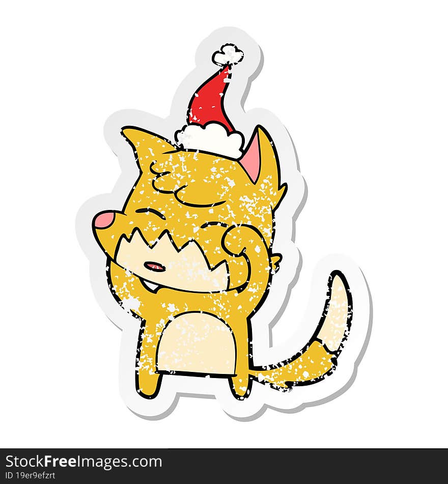 distressed sticker cartoon of a fox wearing santa hat