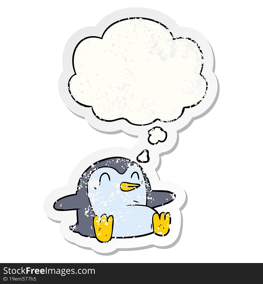 cartoon penguin and thought bubble as a distressed worn sticker