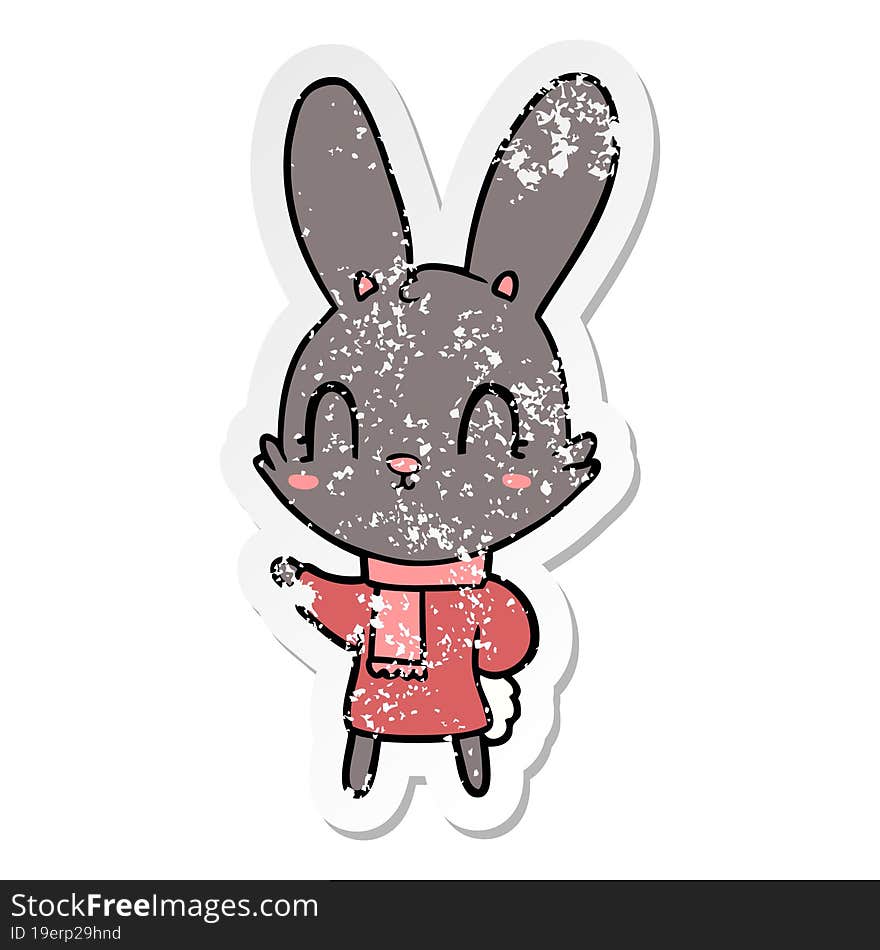 distressed sticker of a cute cartoon rabbit wearing clothes