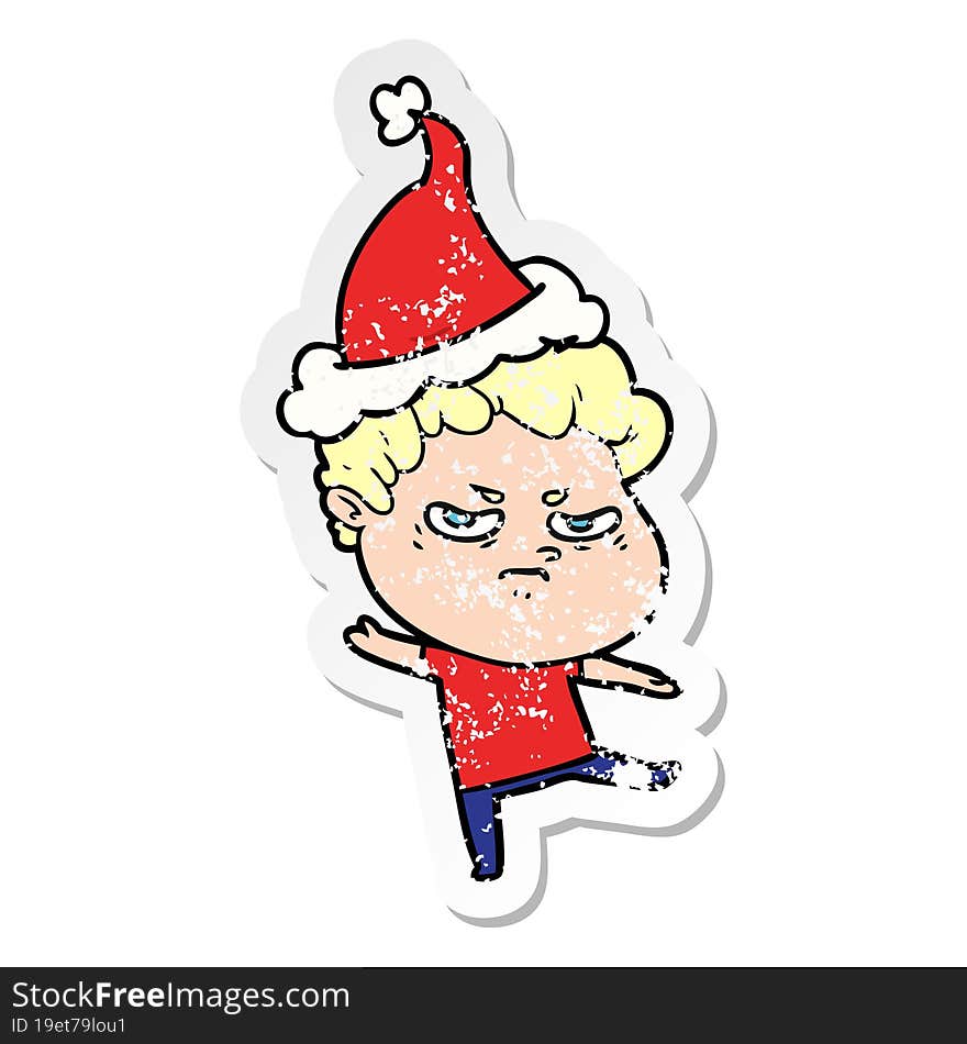 distressed sticker cartoon of a angry man wearing santa hat