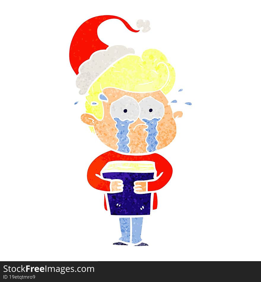 retro cartoon of a crying man holding book wearing santa hat