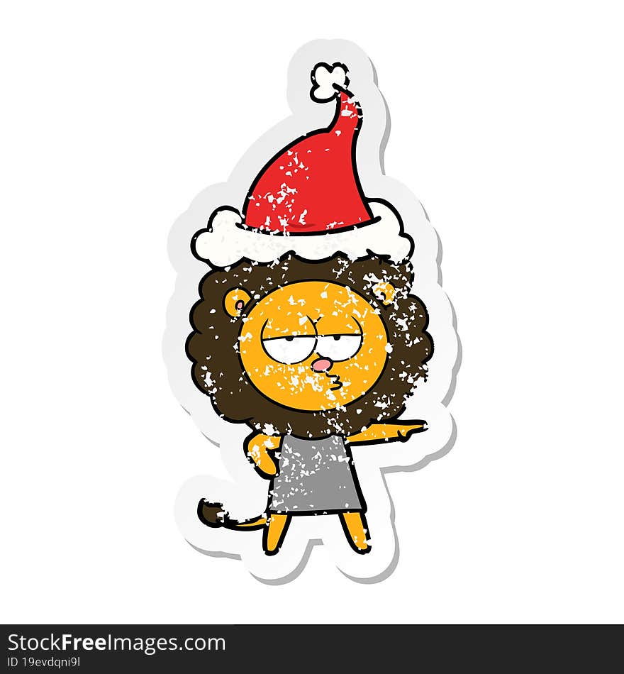 distressed sticker cartoon of a bored lion wearing santa hat