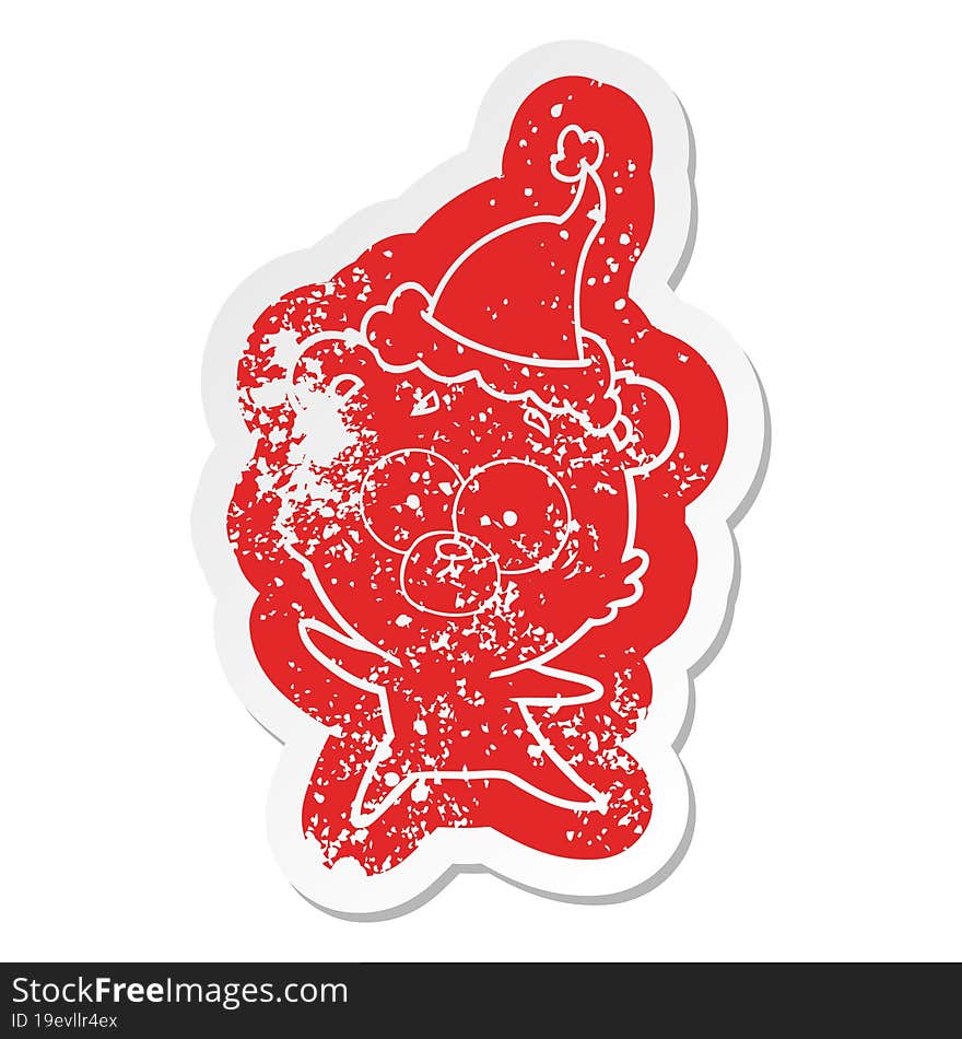 anxious bear cartoon distressed sticker of a wearing santa hat