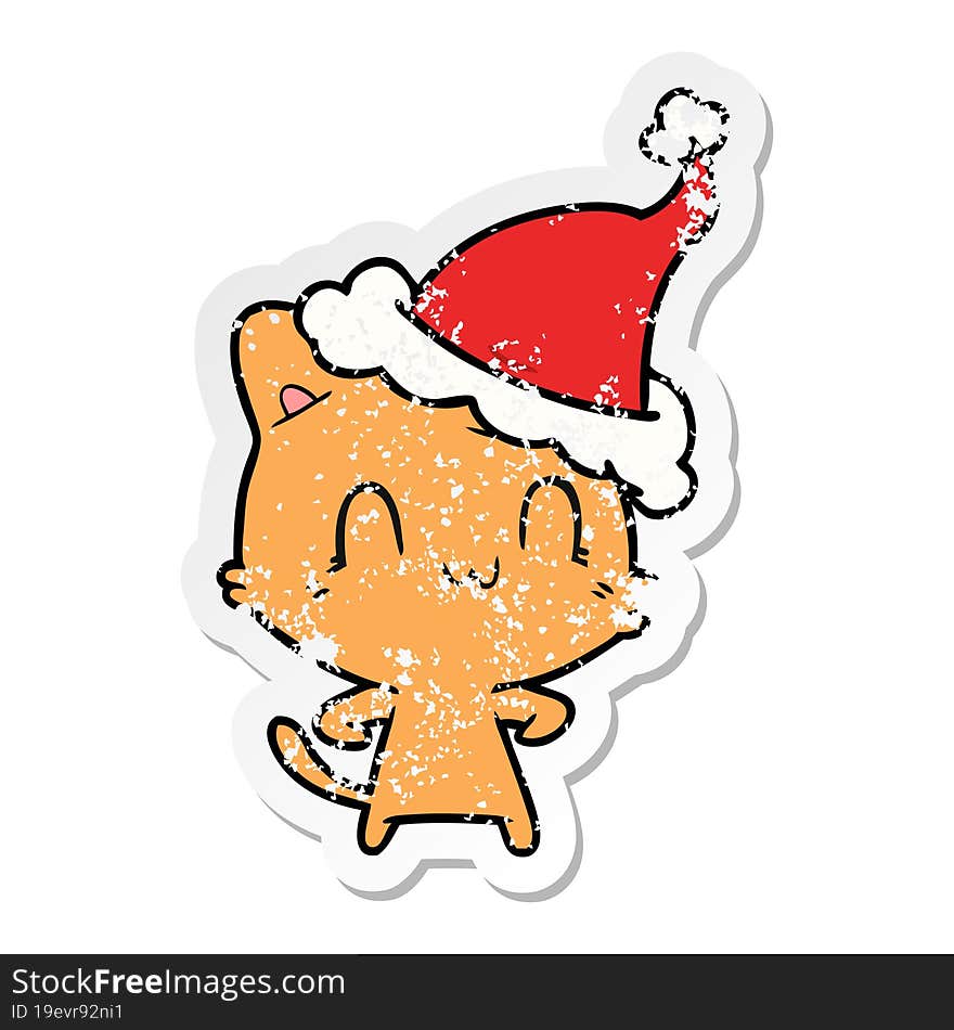 Distressed Sticker Cartoon Of A Happy Cat Wearing Santa Hat