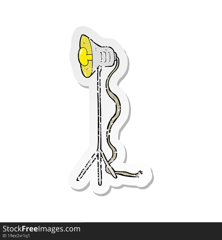 Retro Distressed Sticker Of A Cartoon Studio Lamp Shining