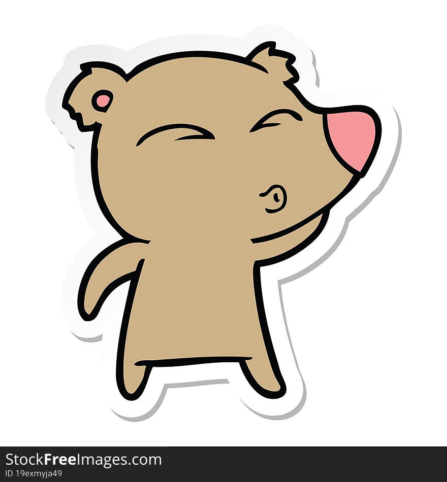 sticker of a cartoon whistling bear