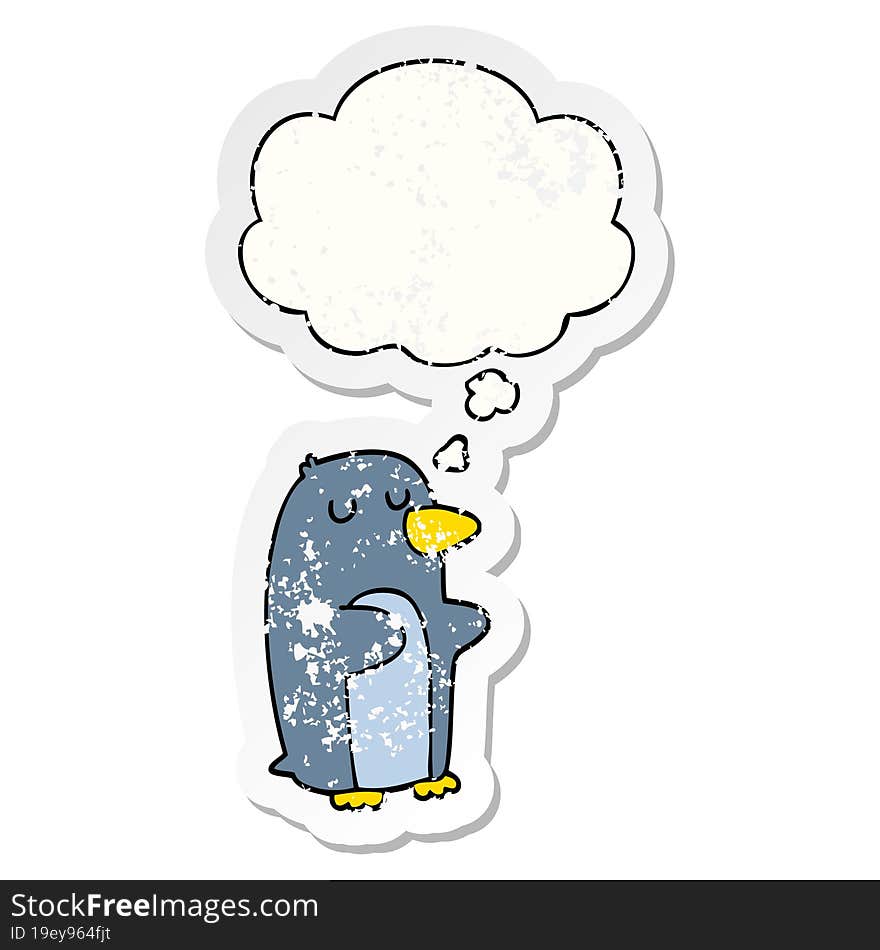 cartoon penguin and thought bubble as a distressed worn sticker