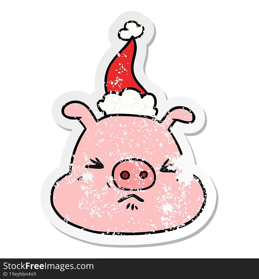 distressed sticker cartoon of a angry pig face wearing santa hat