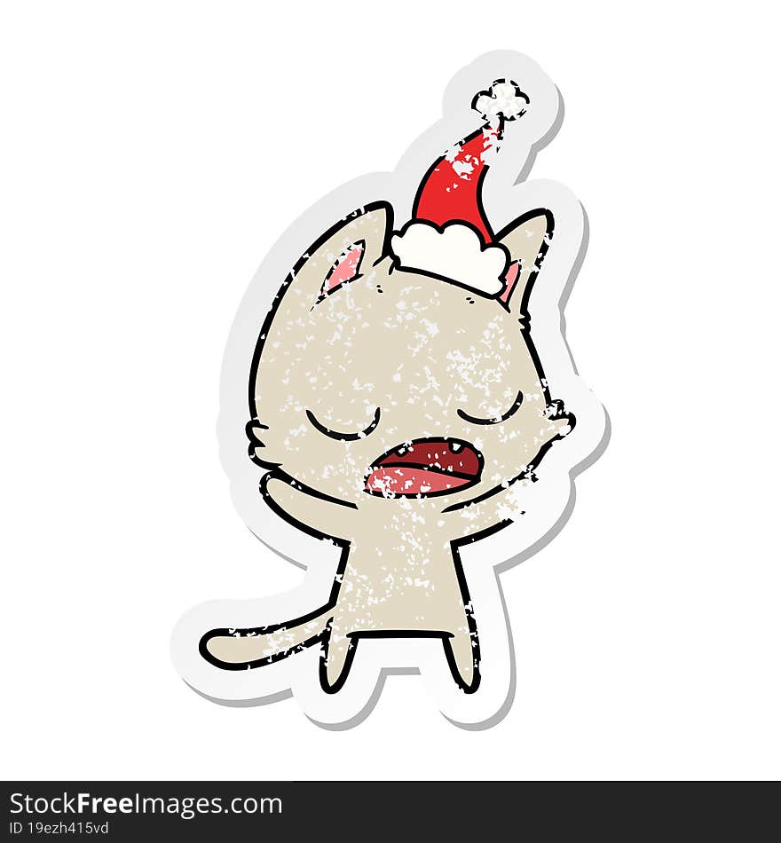 talking cat distressed sticker cartoon of a wearing santa hat