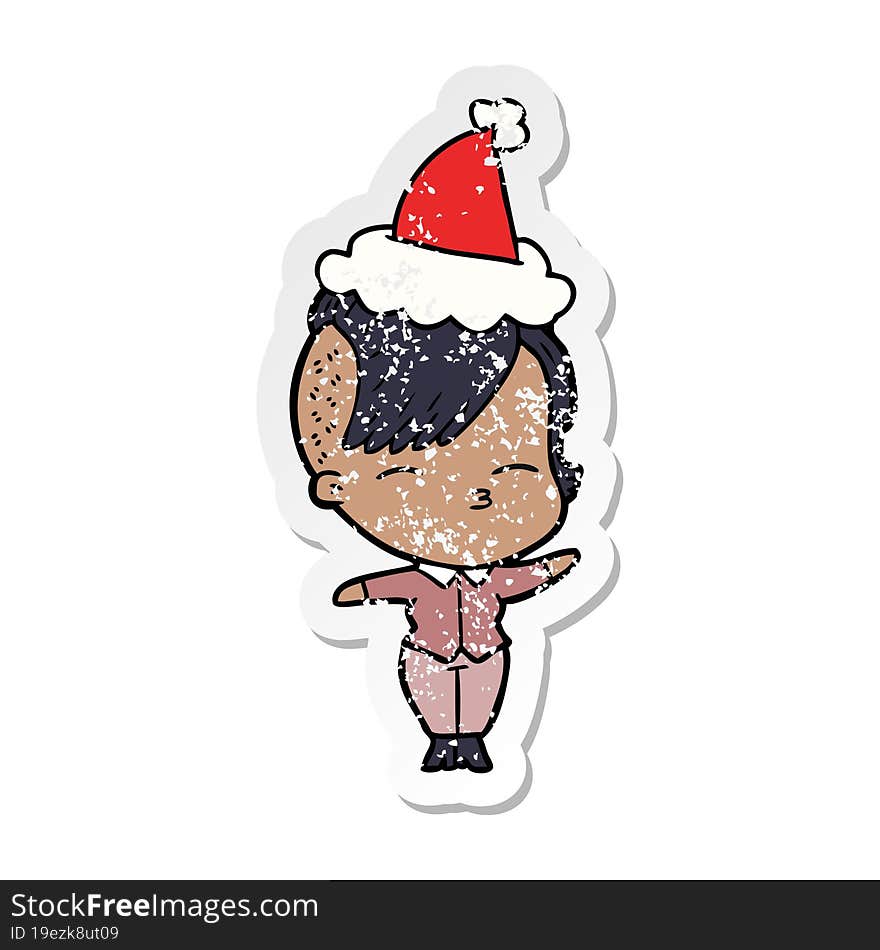 distressed sticker cartoon of a squinting girl wearing santa hat