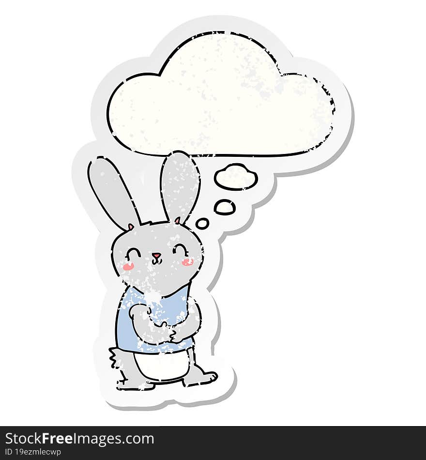 cute cartoon rabbit and thought bubble as a distressed worn sticker