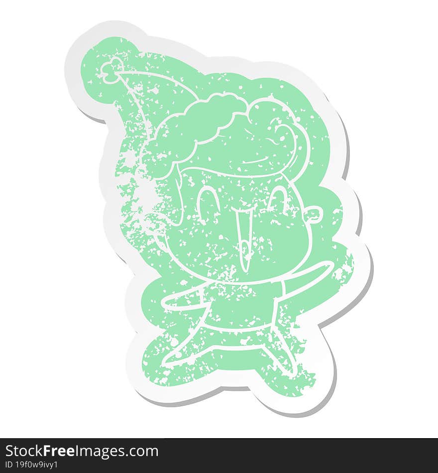 quirky cartoon distressed sticker of a excited man wearing santa hat