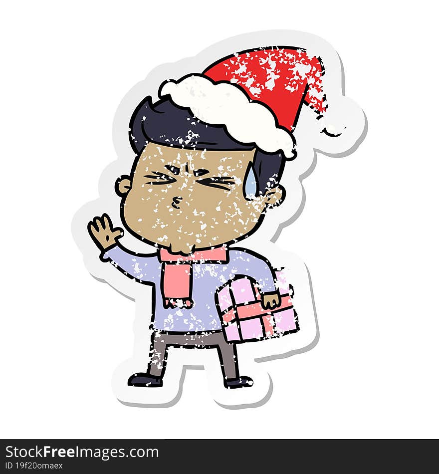 distressed sticker cartoon of a man sweating wearing santa hat